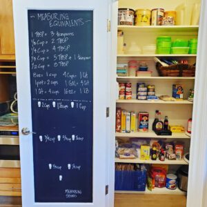 kitchen unpack and pantry food organization door with black chalk board Bella Organizing Professional home organizers and residential packing and moving management company serving the San Francisco Bay Area.