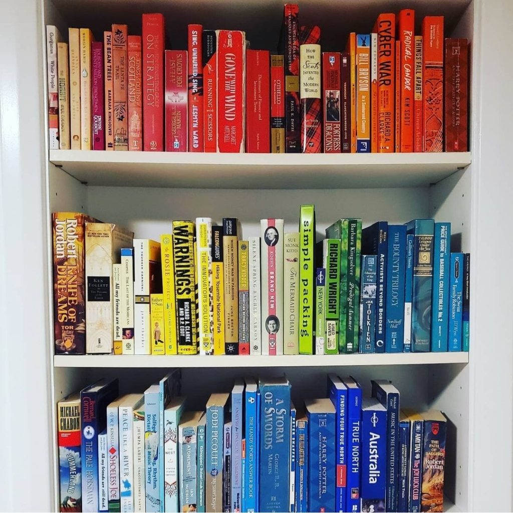 color bookshelf like home edit red blue yellow purple white Bella Organizing Professional home organizers and residential packing and moving management company in the san francisco bay area