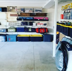 Garage shelves with black and yellow heavy duty Costco bins for camping gear Bella Organizing Professional Home Organizers in Oakland and the San Francisco Bay Area