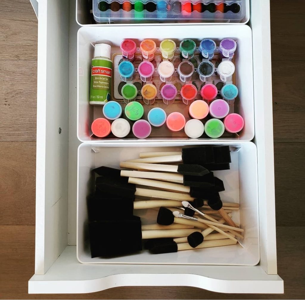 small white plastic bins from ikea for office homework and colorful paint and sponge brush craft storage Bella Organizing Professional home organizers and residential packing and moving management company serving the San Francisco Bay Area.