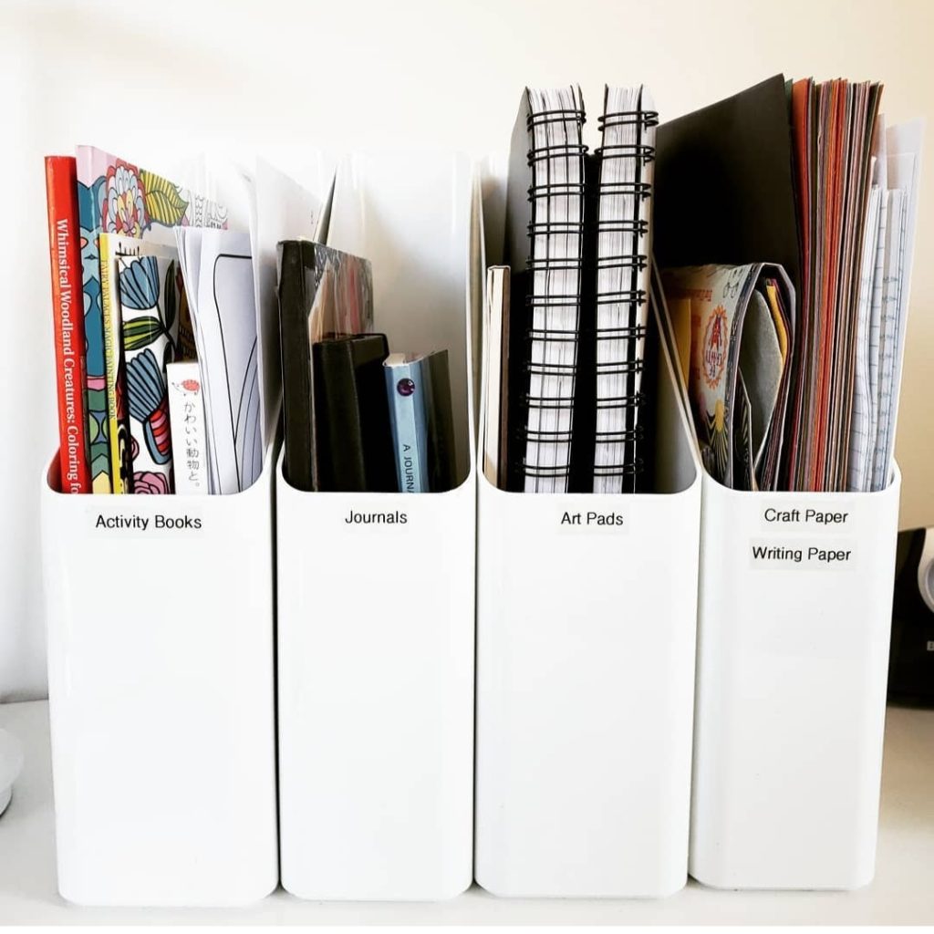 White plastic magazine file bins from ikea for office homework and craft storage Bella Organizing Professional home organizers and residential packing and moving management company serving the San Francisco Bay Area.