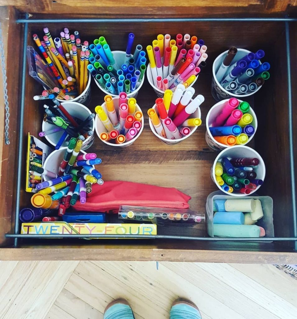 colorful pens pencils markers creative cup storage in brown wooden bin Bella Organizing Professional home organizers and residential packing and moving management company serving the San Francisco Bay Area.