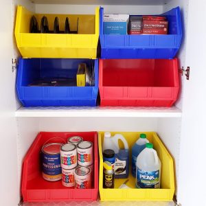Garage with Colorful Primary Color Red Yellow Blue Bins and White Cabinet Shelves by Bella Organizing Professional Home Organizers in Oakland and the San Francisco Bay Area