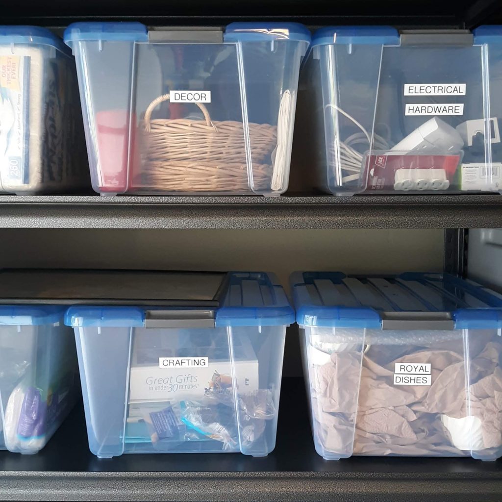 Garage with Clear Bins and Metal Shelves from Costco with labels by Bella Organizing Professional Home Organizers in Oakland and the San Francisco Bay Area