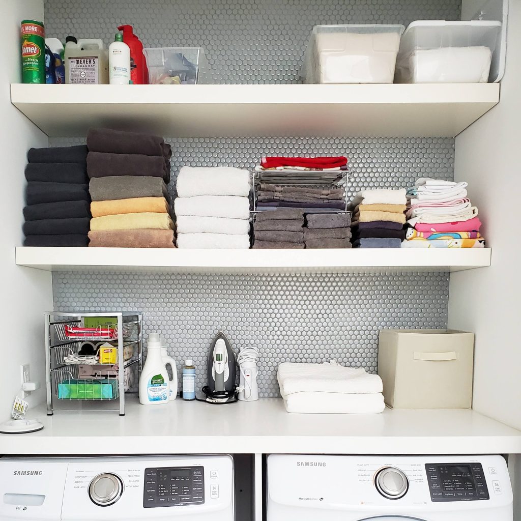 Laundry room with shelves and fold towels Bella Organizing Professional Home Organizers in Oakland and the San Francisco Bay Area