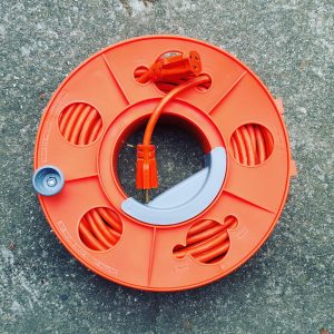 Garage Tool and Round Electric Orange Cord Storage by Bella Organizing Professional Home Organizers in Oakland and the San Francisco Bay Area