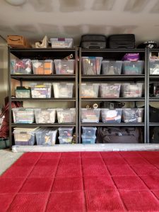 Garage with Clear Bins and Metal Shelves from Costco and red rug carpet by Bella Organizing Professional Home Organizers in Oakland and the San Francisco Bay Area
