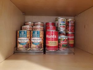 pantry food cabinet storage shelf risers Bella Organizing Professional home organizers and residential packing and moving management company serving the San Francisco Bay Area.