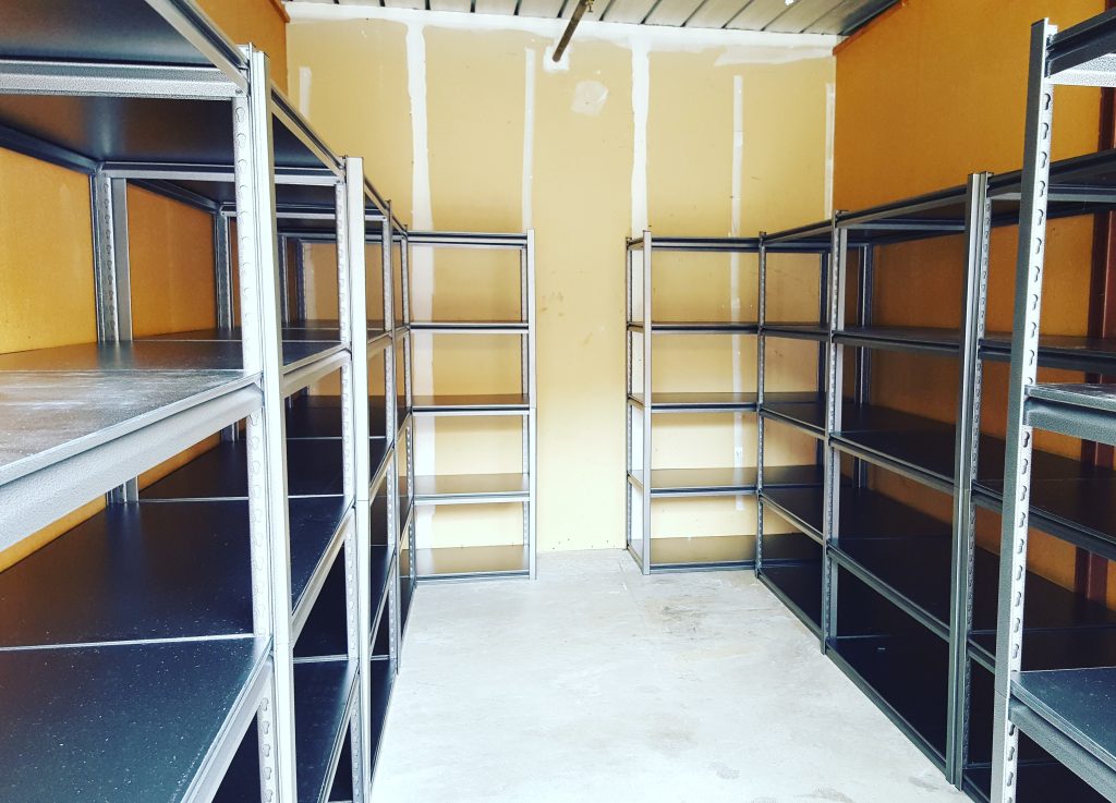 metal storage unit declutter and organize with shelves from Costco built by Isabella Bella Organizing Professional home organizers and residential packing and moving management company serving the San Francisco Bay Area.